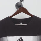 Close-up of the collar and tag on the Vintage Y2K Adidas "Pixelated Bar Logo" T-Shirt - L
