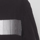 Close-up of the Right sleeve on the Vintage Y2K Adidas "Pixelated Bar Logo" T-Shirt - L