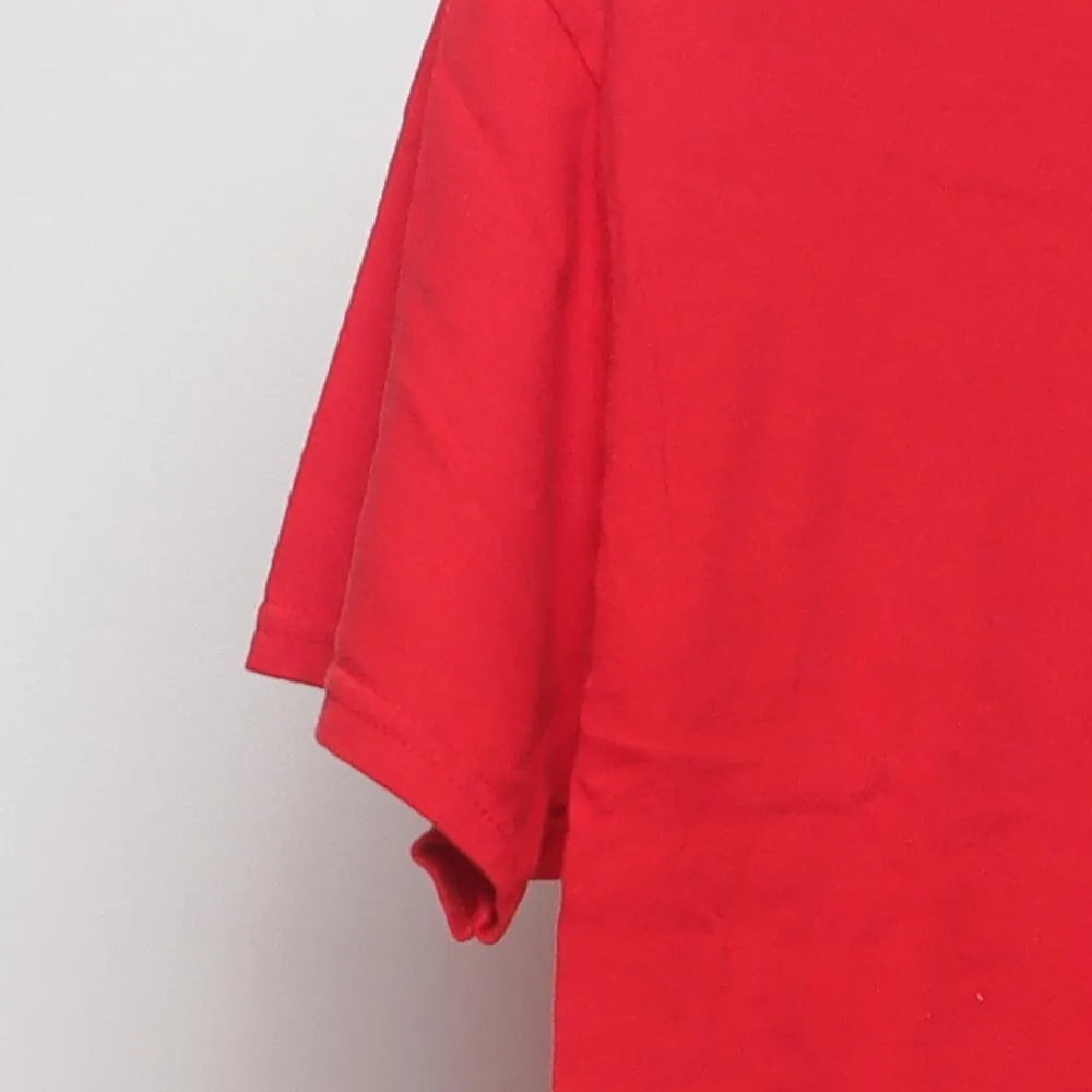 Close-up of the sleeve on the Vintage Y2K Coca-Cola "Classic Script Logo" T-Shirt - M