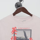 Close-up of the collar and tag on the Vintage Y2K Fashion Nova "Live Fast Luxury Dreams" T-Shirt - L