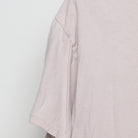 Close-up of the single stitch sleeve on the Vintage Y2K Fashion Nova "Live Fast Luxury Dreams" T-Shirt - L