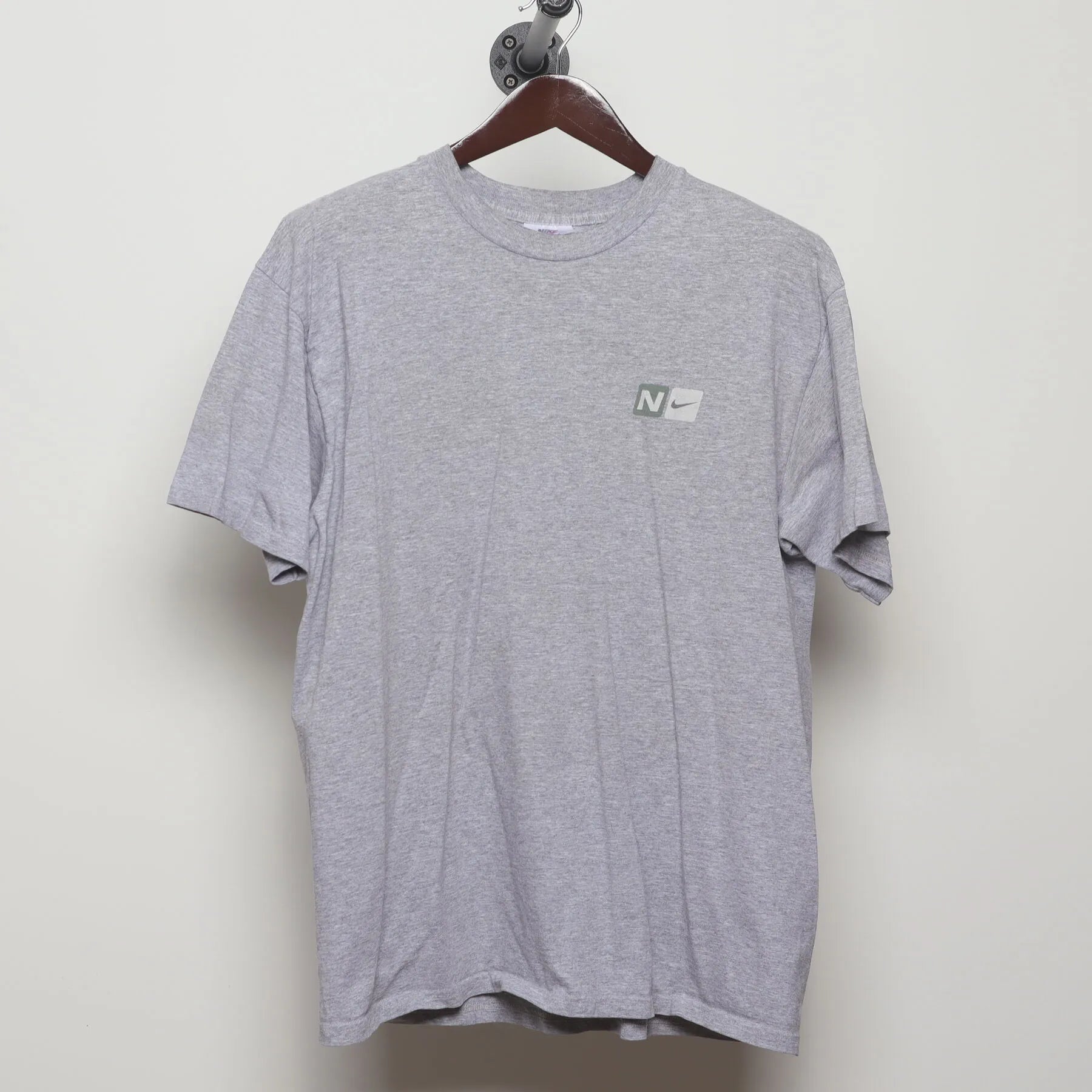 Front view of Vintage Y2K Nike "Athletics Engineered for Performance" T-Shirt - L