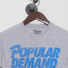 Close-up of the collar and tag on the Vintage Y2K Popular Demand "Popular Demand" T-Shirt - XS