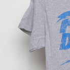 Close-up of the Left sleeve on the Vintage Y2K Popular Demand "Popular Demand" T-Shirt - XS
