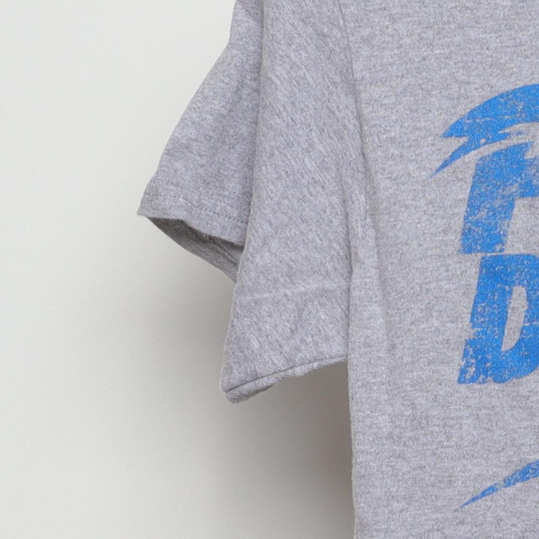 Close-up of the Left sleeve on the Vintage Y2K Popular Demand "Popular Demand" T-Shirt - XS