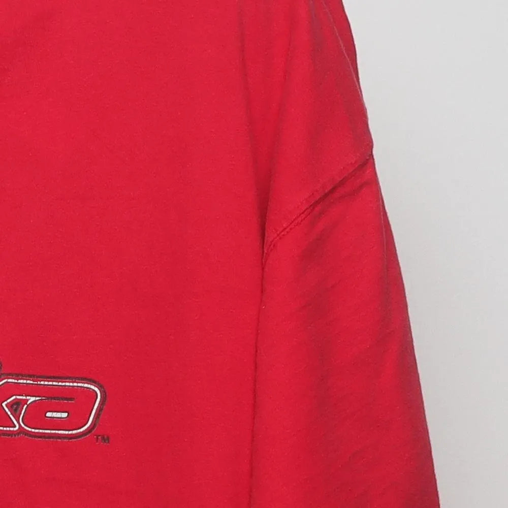 Close-up of the sleeve on the Vintage Y2K Starter Nebraska Huskers "Big N Logo" T-Shirt - XL