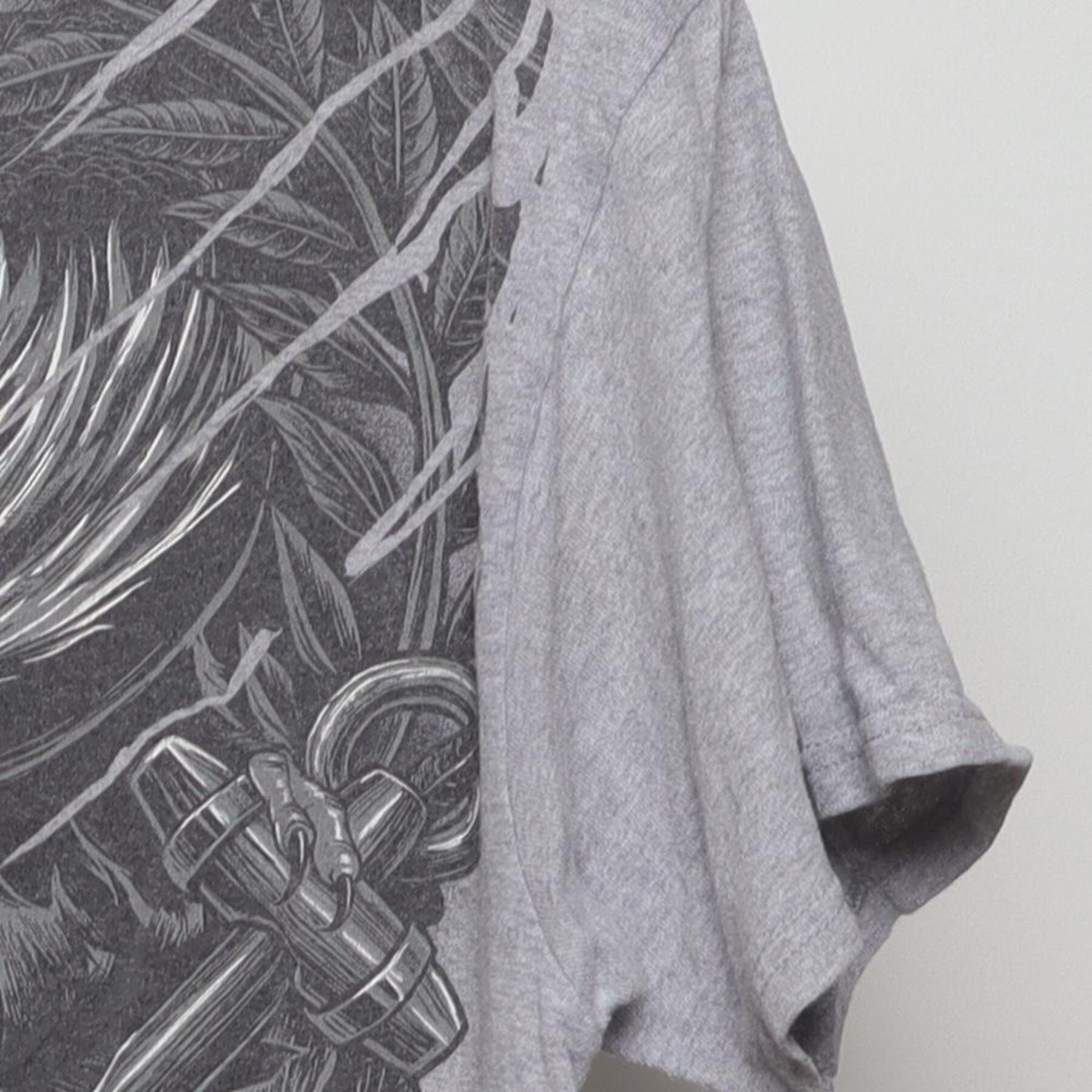Close-up of the single stitch sleeve on the Vintage Y2K Tool "Dragon Graphic" T-Shirt - M