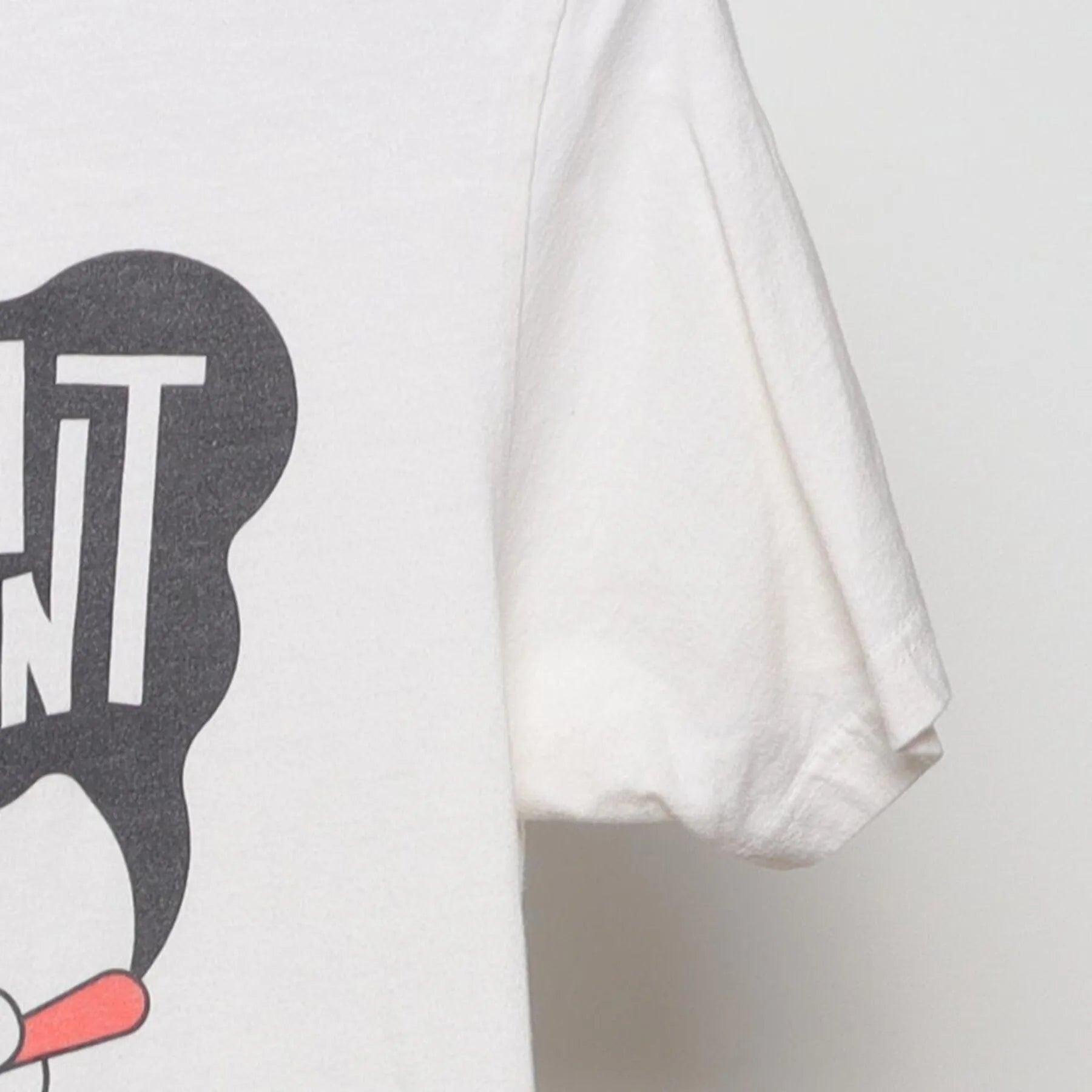 Close-up of the Right sleeve on the Vintage 2010s Young the Giant "Lounging Smoker" T-Shirt - XS