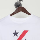 Close-up of the collar and tag on the Vintage Y2K 100% "Stars & Slash" T-Shirt - M
