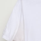 Close-up of the Left sleeve on the Vintage Y2K 100% "Stars & Slash" T-Shirt - M