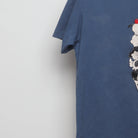Close-up of the sleeve on the 2010s Uniqlo Peanuts Ice Cream Graphic Tee S