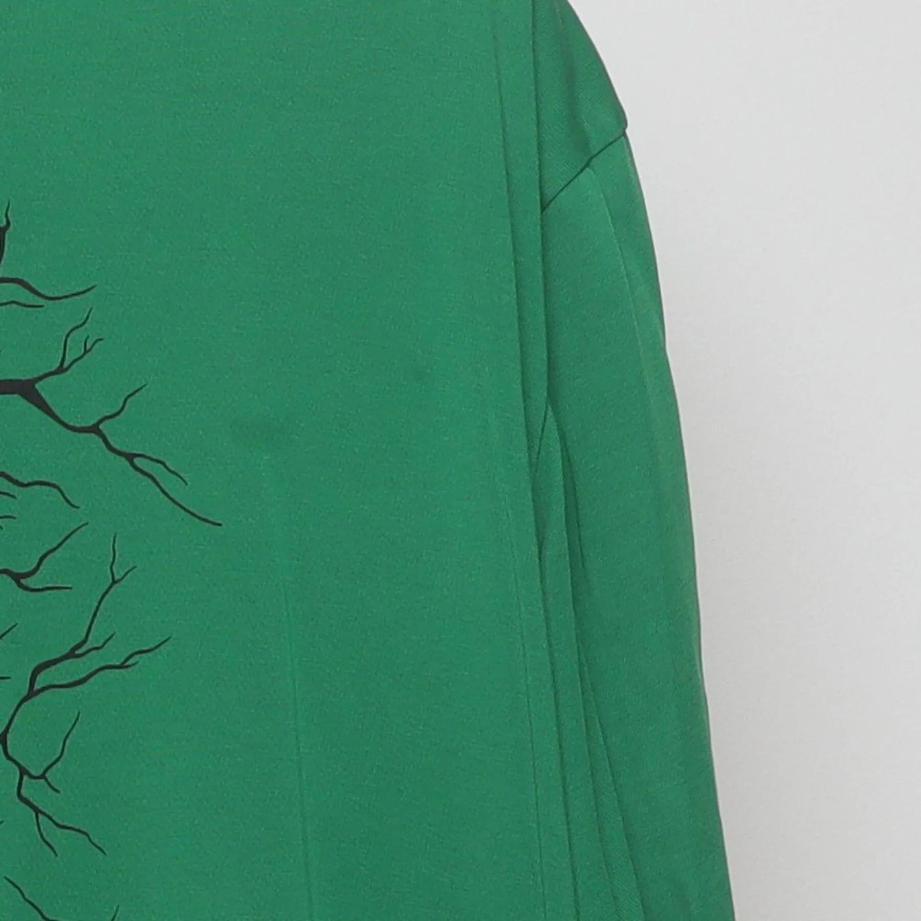 Right sleeve detail of Vintage Nike Dri-Fit Green Graphic T-Shirt Cracked Shield Swoosh Logo