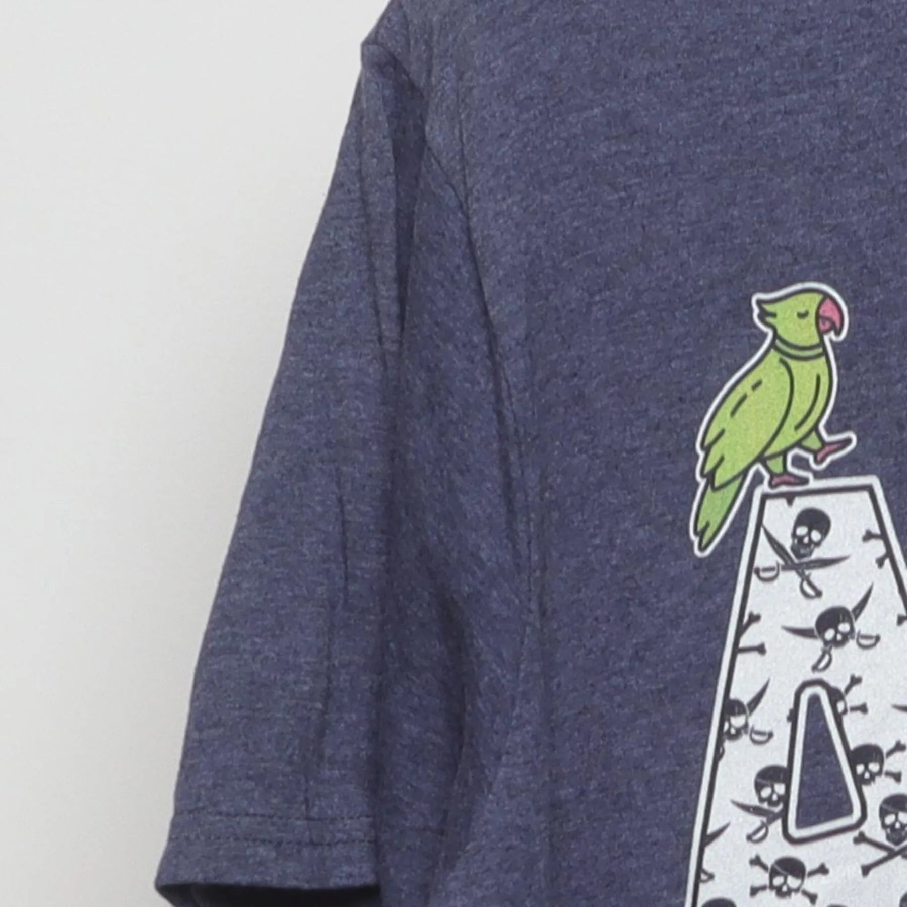 Left sleeve detail of ARRGH Pirate Graphic T-Shirt Heather Blue Jolly Roger Parrot Tee
