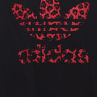Close-up of the main graphic on the Vintage Y2K Adidas "Red Leopard Trefoil Logo" T-Shirt - XL