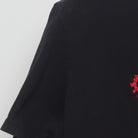 Close-up of the Left sleeve on the Vintage Y2K Adidas "Red Leopard Trefoil Logo" T-Shirt - XL