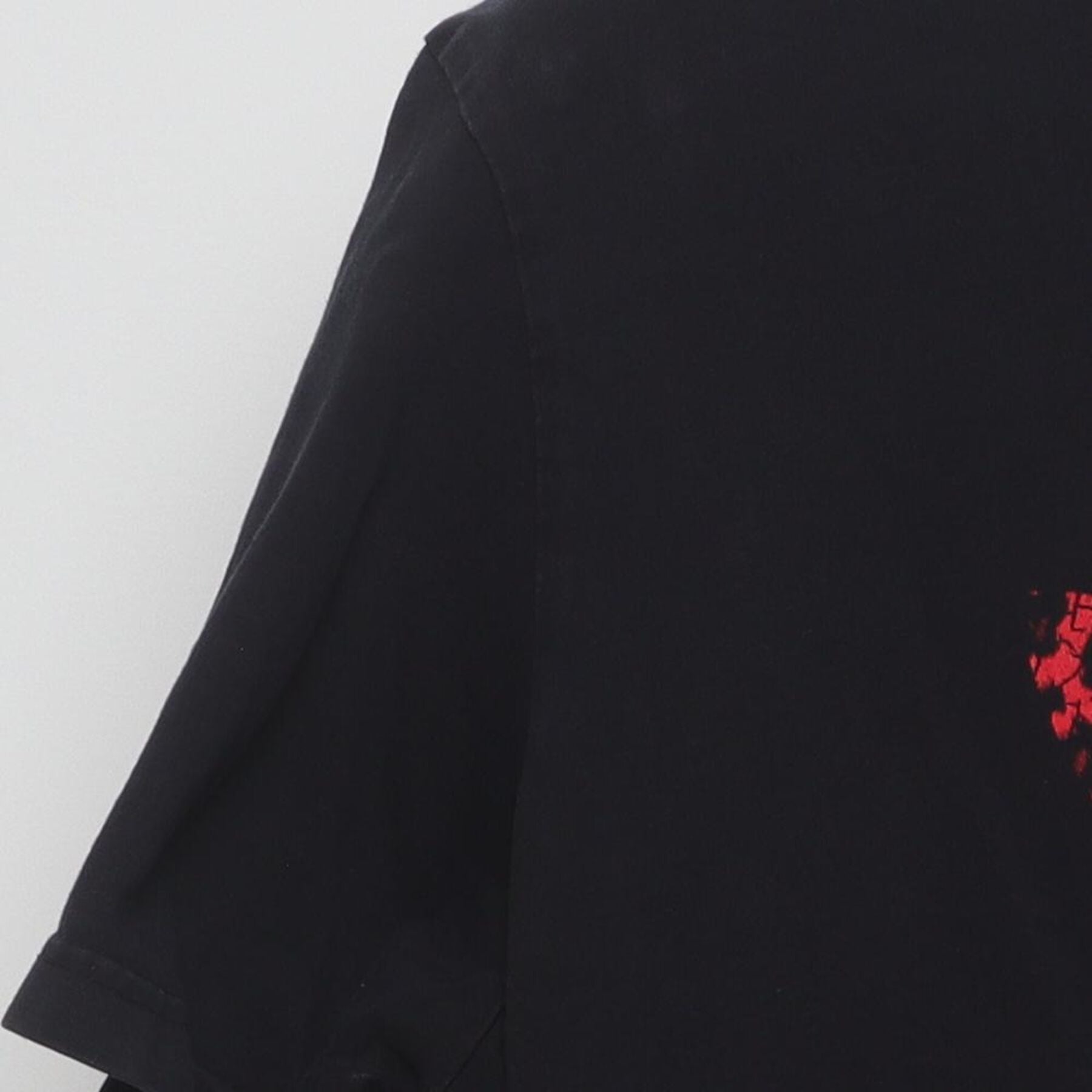 Close-up of the Left sleeve on the Vintage Y2K Adidas "Red Leopard Trefoil Logo" T-Shirt - XL