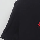 Close-up of the Left sleeve on the Vintage Y2K Adidas "Red Leopard Trefoil Logo" T-Shirt - XL