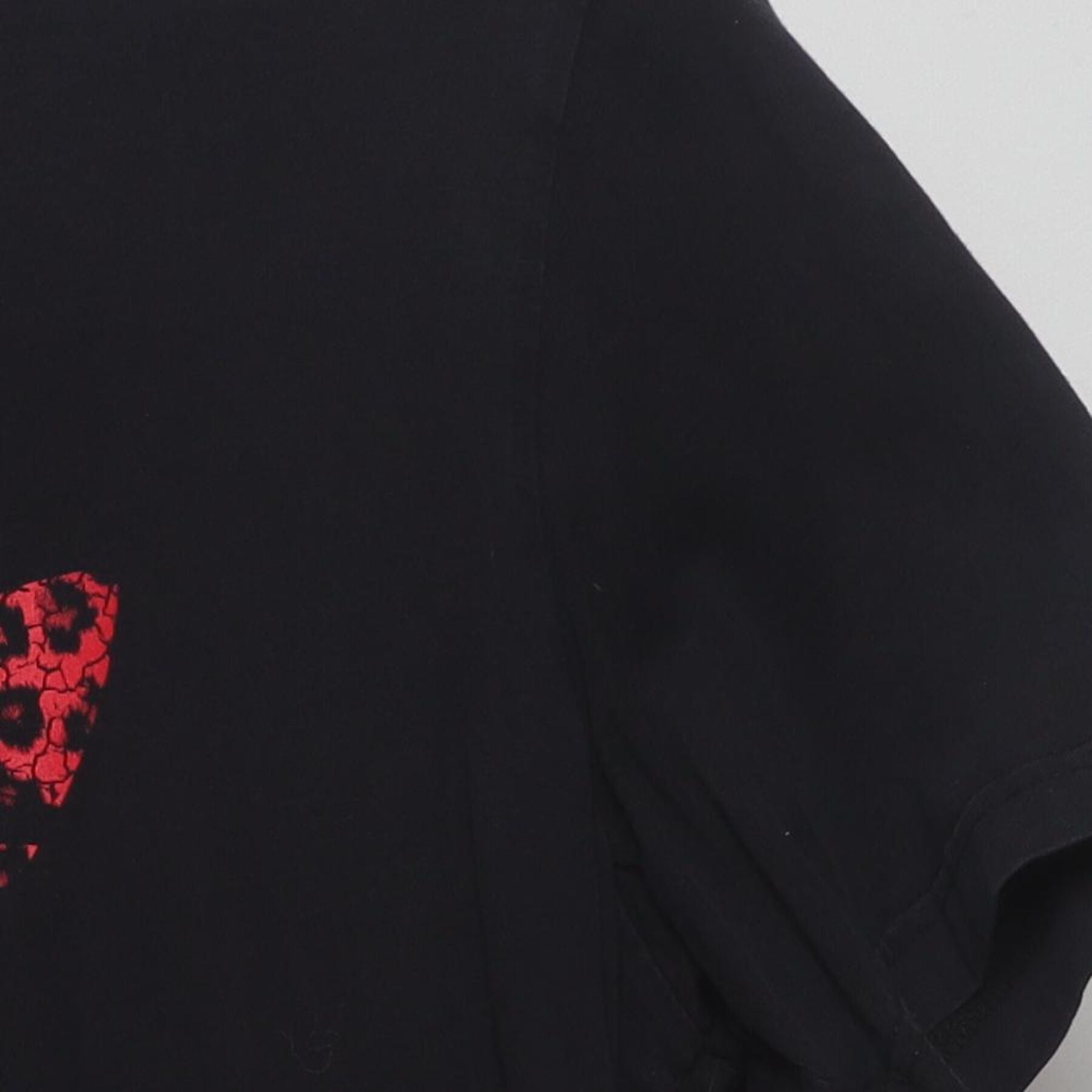 Close-up of the Right sleeve on the Vintage Y2K Adidas "Red Leopard Trefoil Logo" T-Shirt - XL