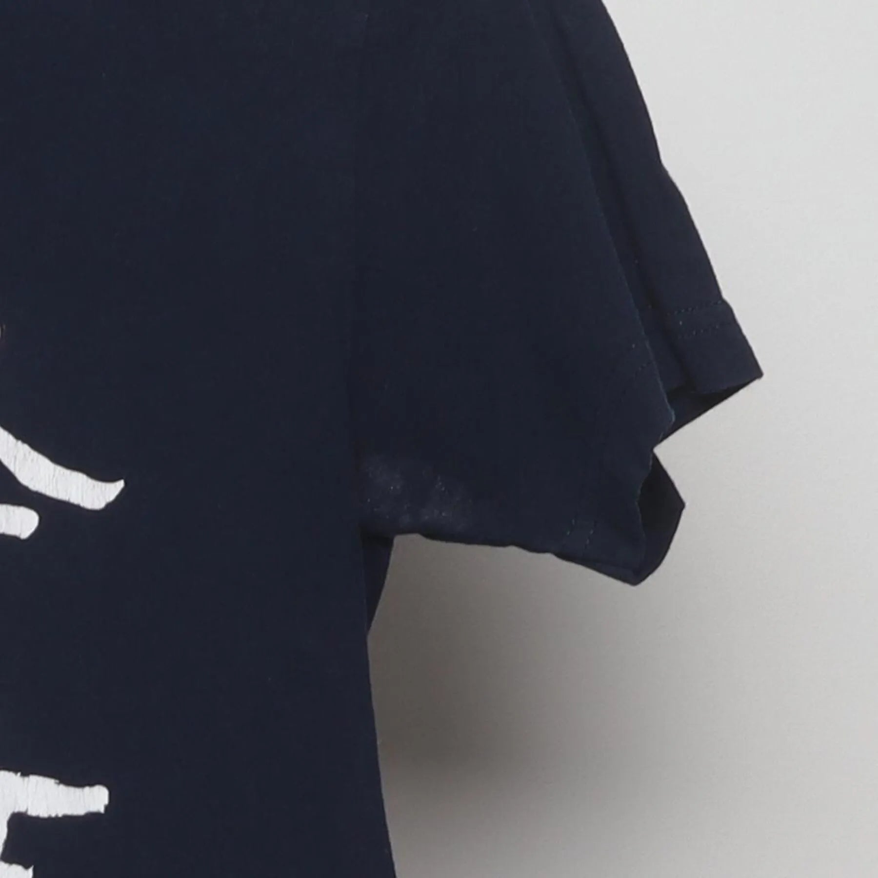 Close-up of the Right sleeve on the Vintage Y2K Avatar: The Last Airbender "Team Avatar Totem" T-Shirt - XS