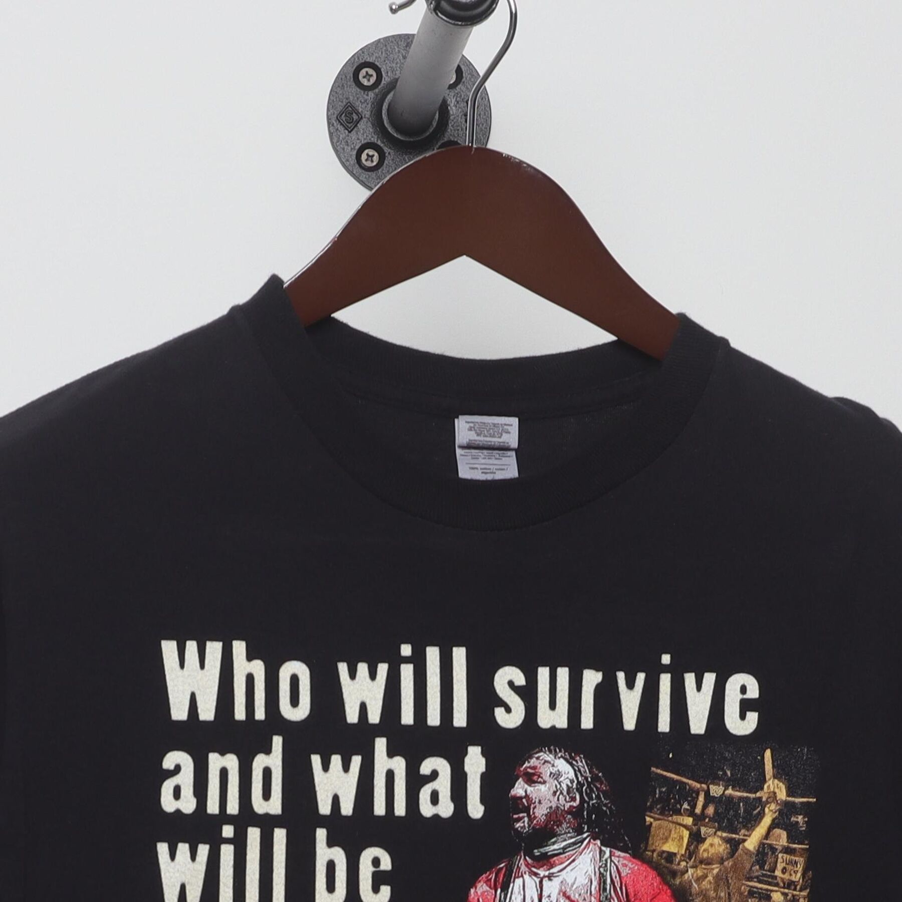 Close-up of the collar and tag on the Vintage Y2K WWF "The Chainsaw Charlie Massacre" T-Shirt - M