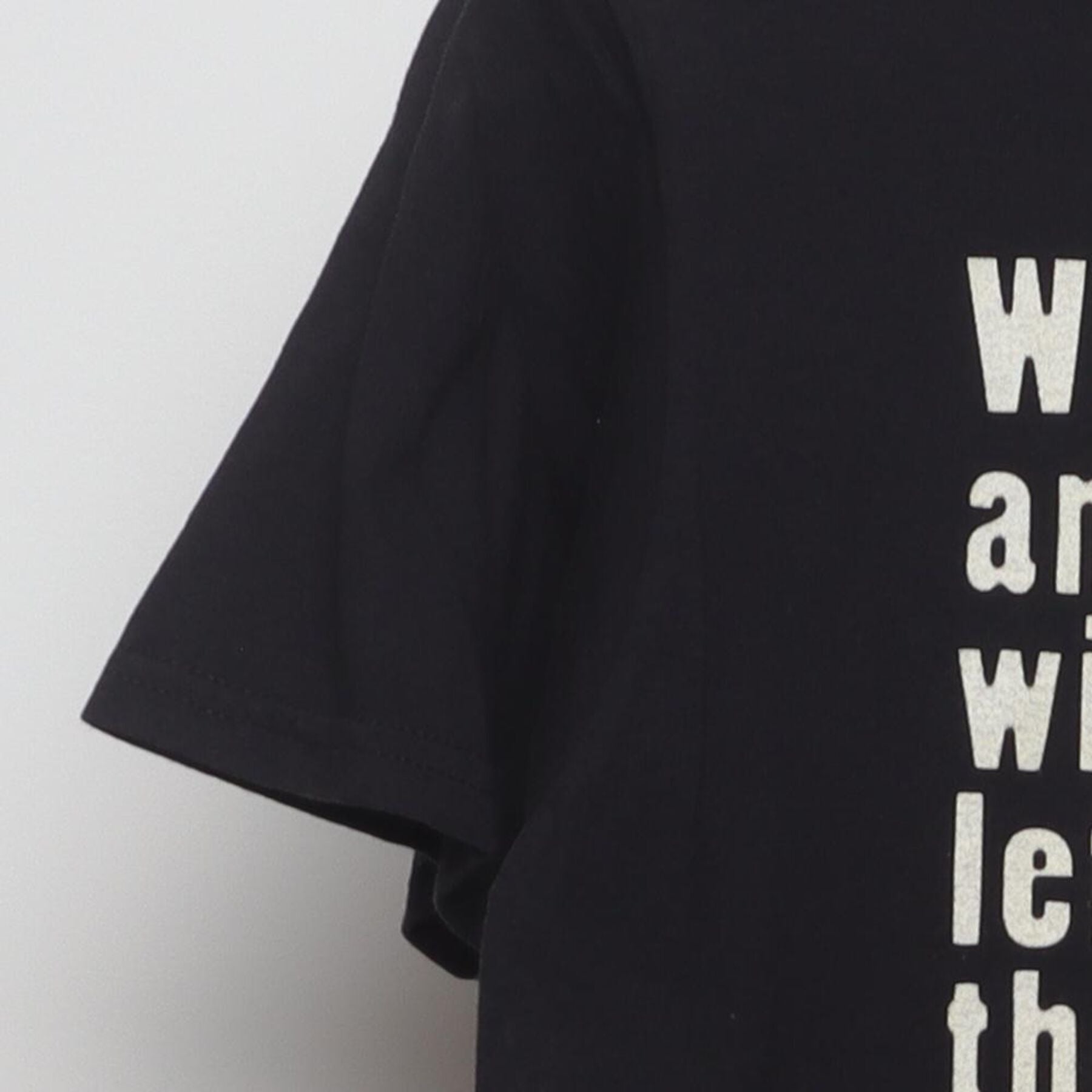 Close-up of the Left sleeve on the Vintage Y2K WWF "The Chainsaw Charlie Massacre" T-Shirt - M