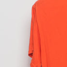 Close-up of the Left sleeve on the Vintage Y2K Halloween "Jack-O'-Lantern Face" T-Shirt - S