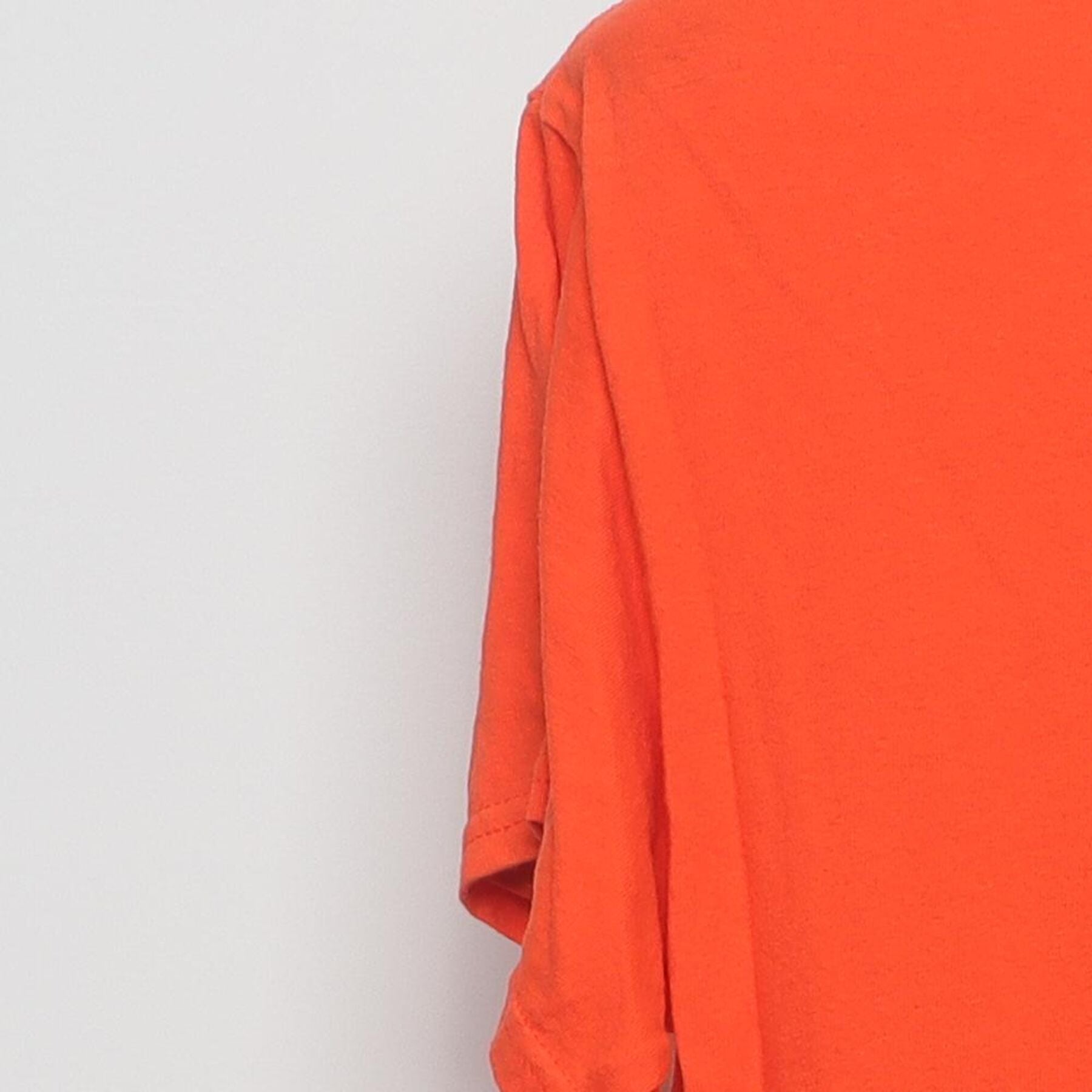 Close-up of the Left sleeve on the Vintage Y2K Halloween "Jack-O'-Lantern Face" T-Shirt - S