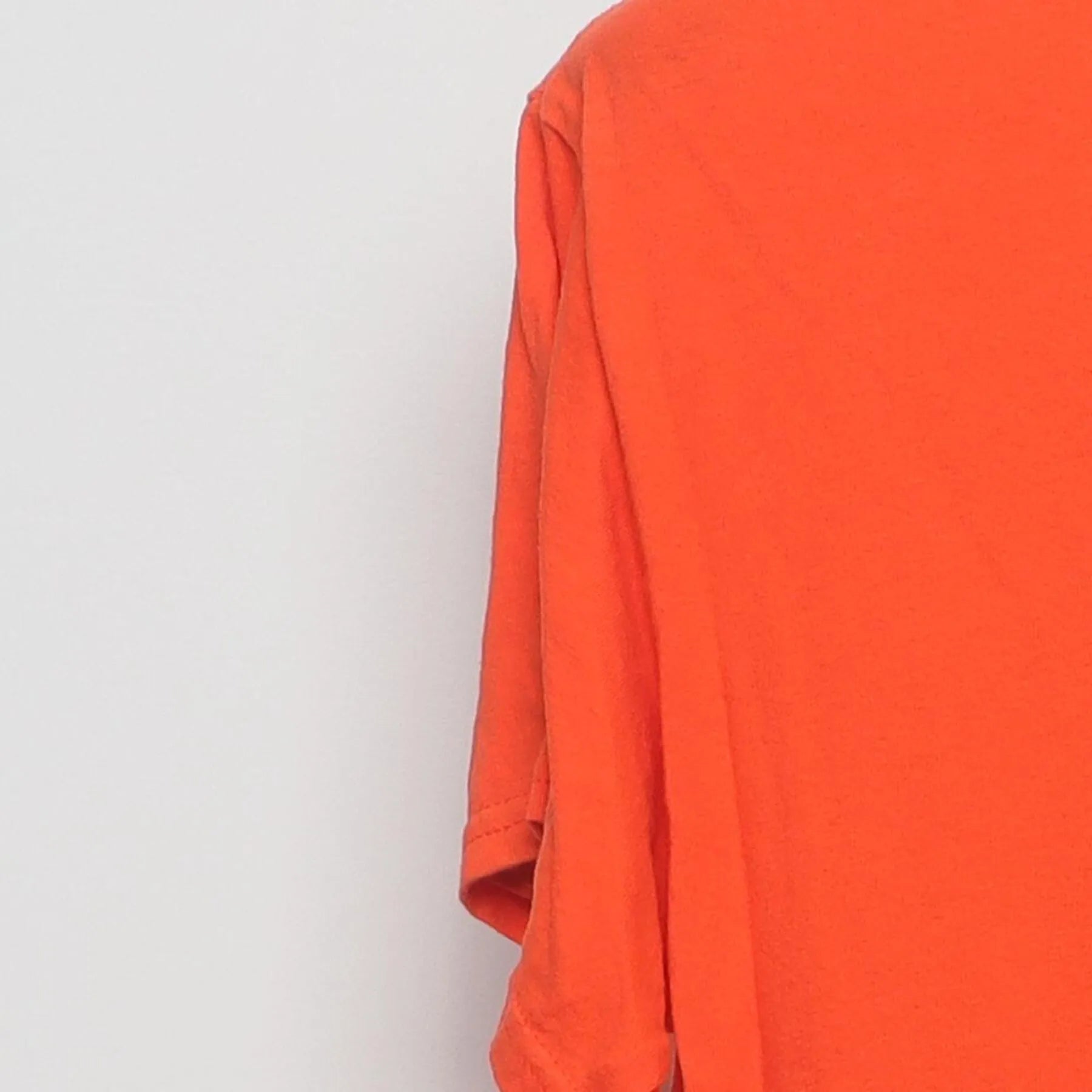 Close-up of the Left sleeve on the Vintage Y2K Halloween "Jack-O'-Lantern Face" T-Shirt - S