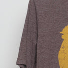 Close-up of the Left sleeve on the Vintage Y2K Dole Plantation "Pineapple Rooster" T-Shirt - M