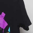 Close-up of the Right sleeve on the Vintage Y2K Extrax "Graffiti Smiley" T-Shirt - M