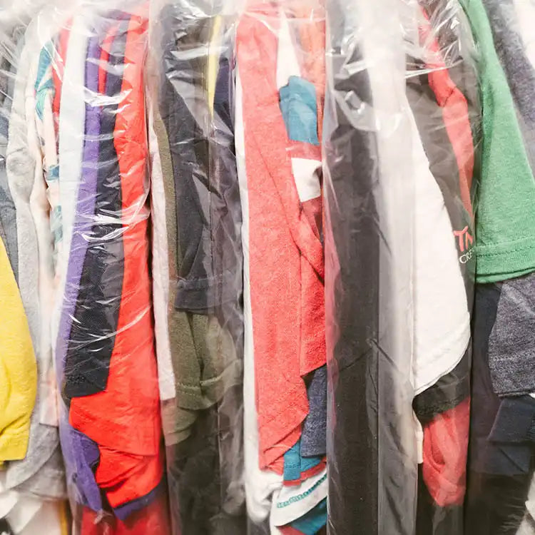 Professionally laundered Faded Vibes t-shirts in plastic bags, showing our quality control and curation process.