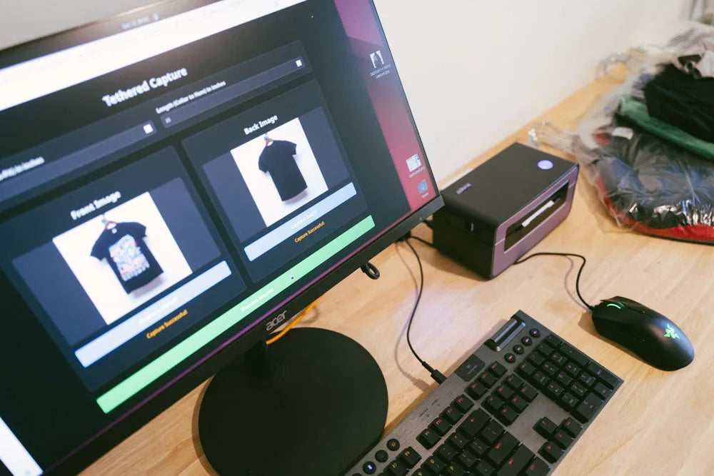 The Faded Vibes custom workstation using 'Tethered Capture' software to photograph each unique vintage t-shirt.