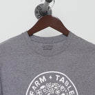 Close-up of the collar and tag on the Vintage Y2K Farm + Table "Pasture Raised" T-Shirt - S