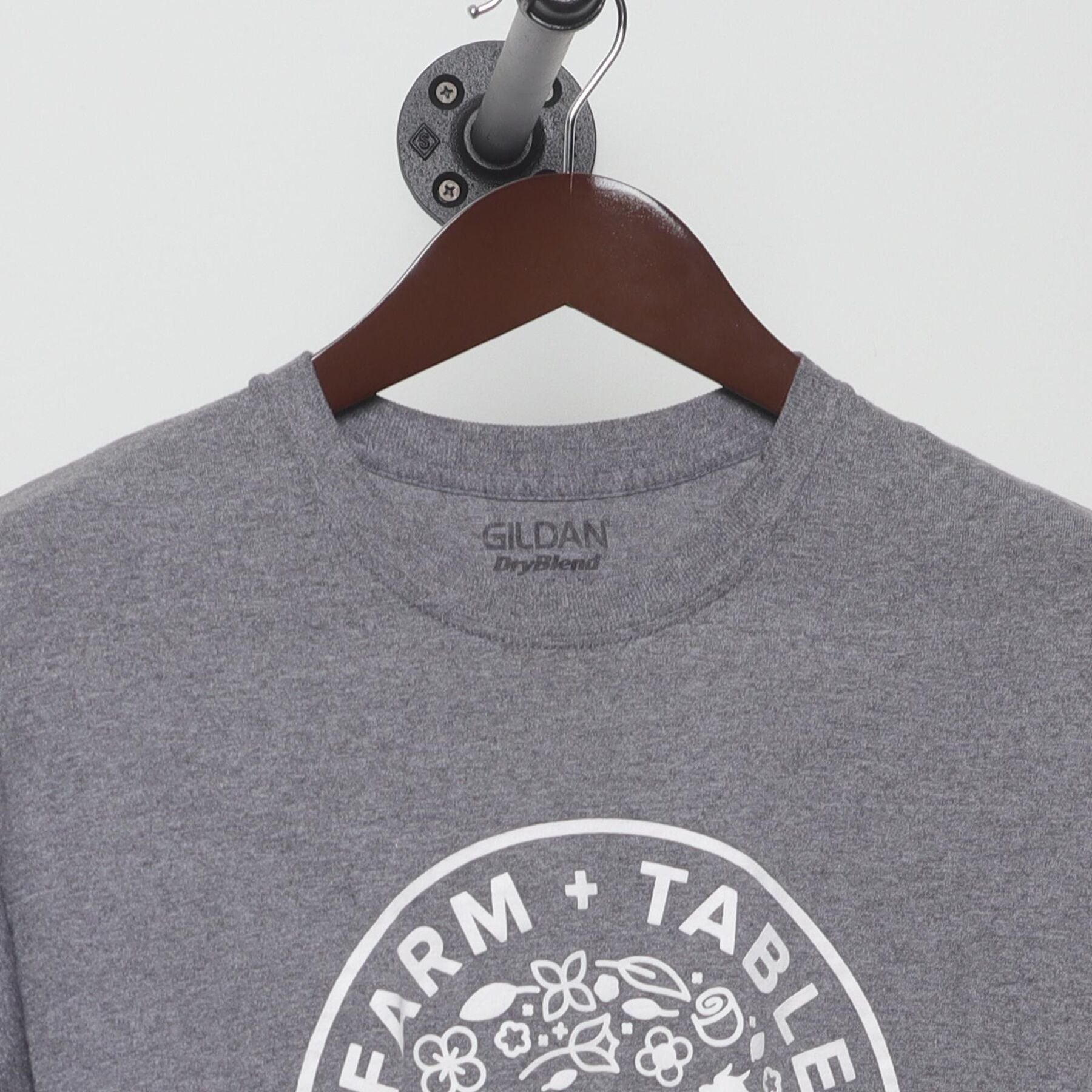 Close-up of the collar and tag on the Vintage Y2K Farm + Table "Pasture Raised" T-Shirt - S