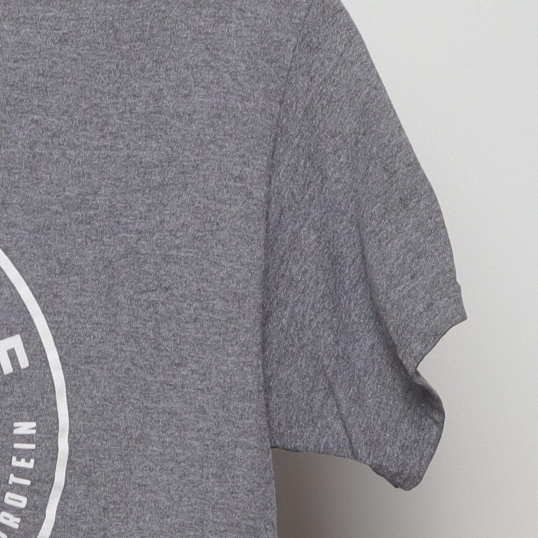 Close-up of the Right sleeve on the Vintage Y2K Farm + Table "Pasture Raised" T-Shirt - S