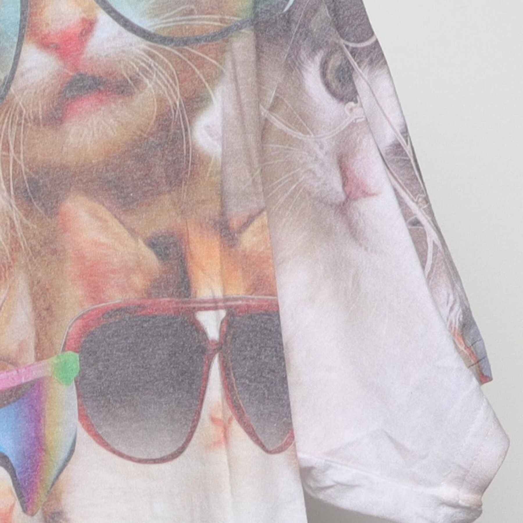 Close-up of the Right sleeve on the Vintage Y2K-Era The Mountain "Cats in Sunglasses" All Over Print T-Shirt - M