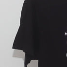 Close-up of the Left sleeve on the Vintage Y2K Graphic "Mad Scientist Unicorn" T-Shirt - S