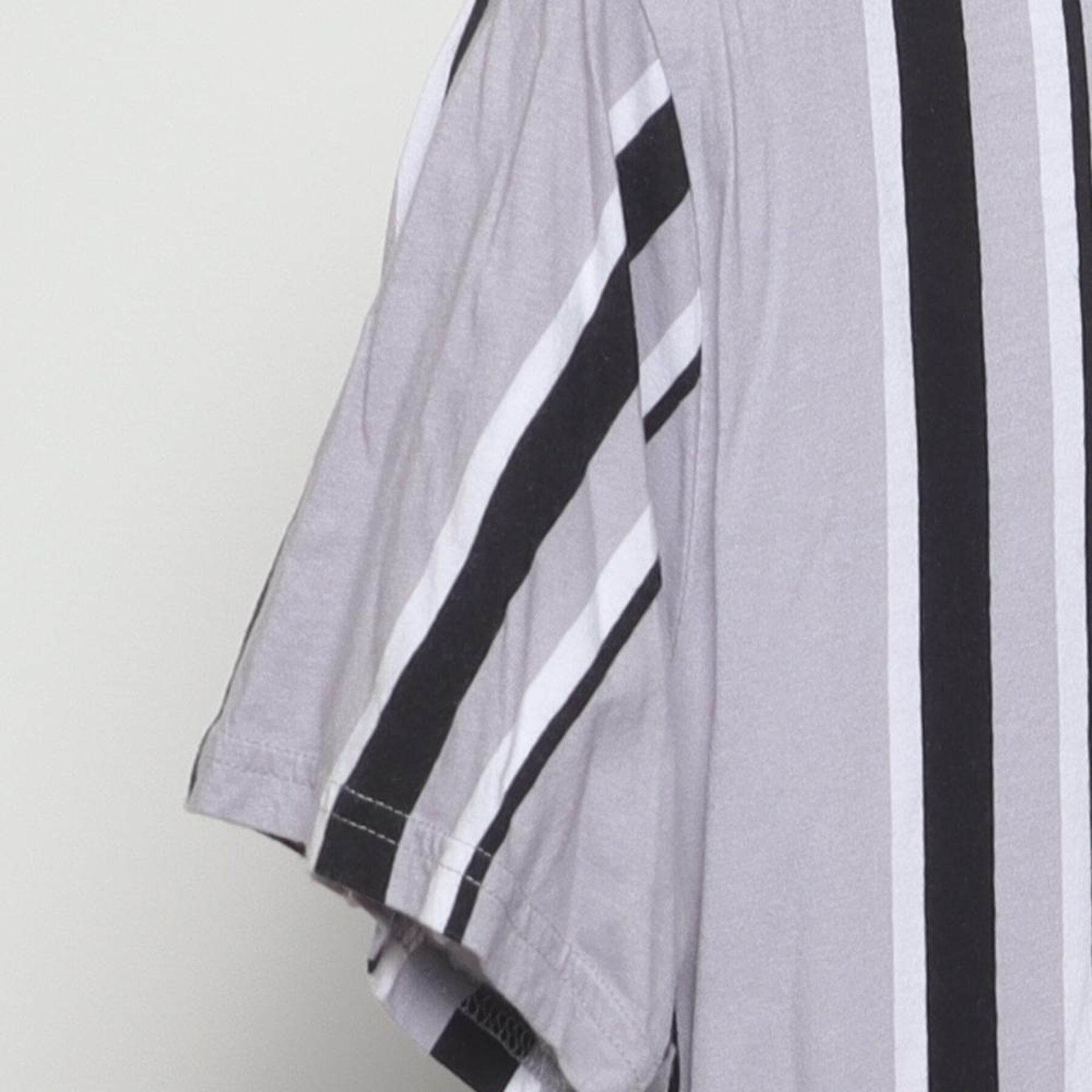 Close-up of the Left sleeve on the Vintage Y2K Hollister "Embroidered Script Logo Striped" T-Shirt - M