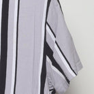 Close-up of the Right sleeve on the Vintage Y2K Hollister "Embroidered Script Logo Striped" T-Shirt - M