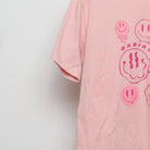 Close-up of the sleeve on the Modern Drippy Smiley Face Graphic Tee L