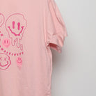 Close-up of the sleeve on the Modern Drippy Smiley Face Graphic Tee L