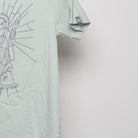 Close-up of the sleeve on the Modern Sloth Saint Parody Graphic T-Shirt XS