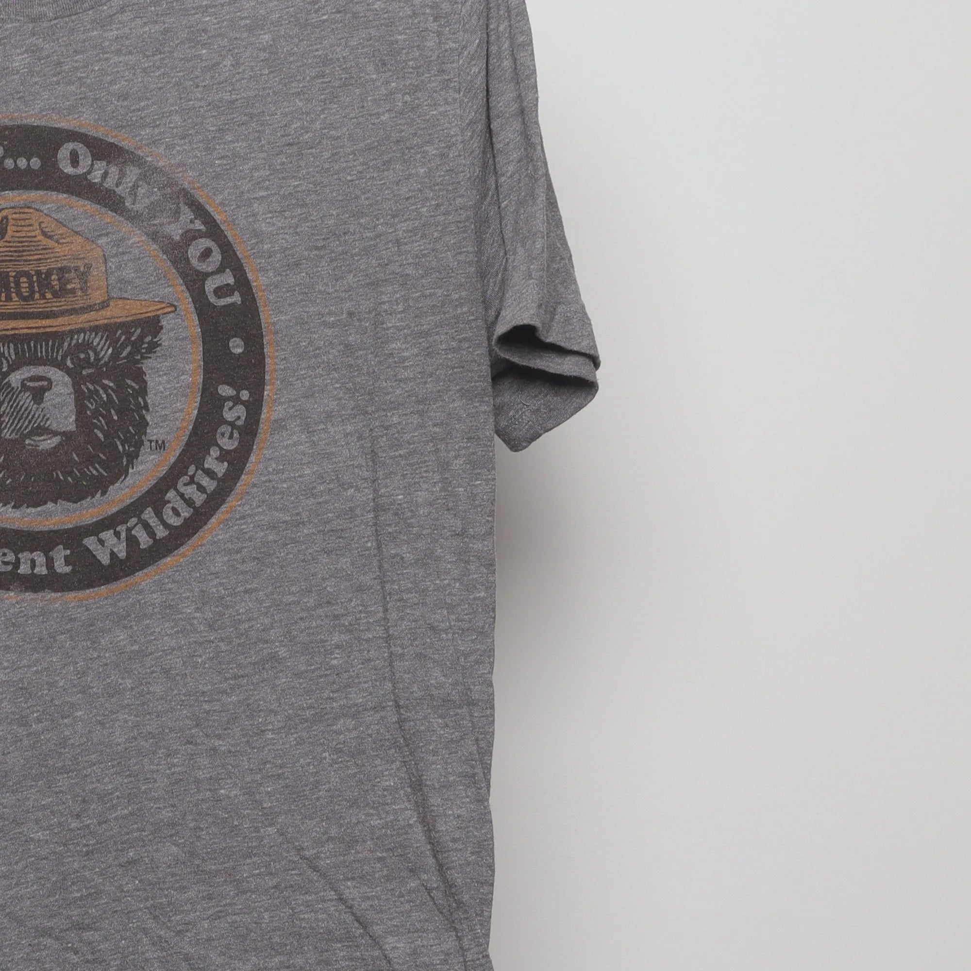 Close-up of the sleeve on the Modern Smokey Bear Retro Graphic T-Shirt M