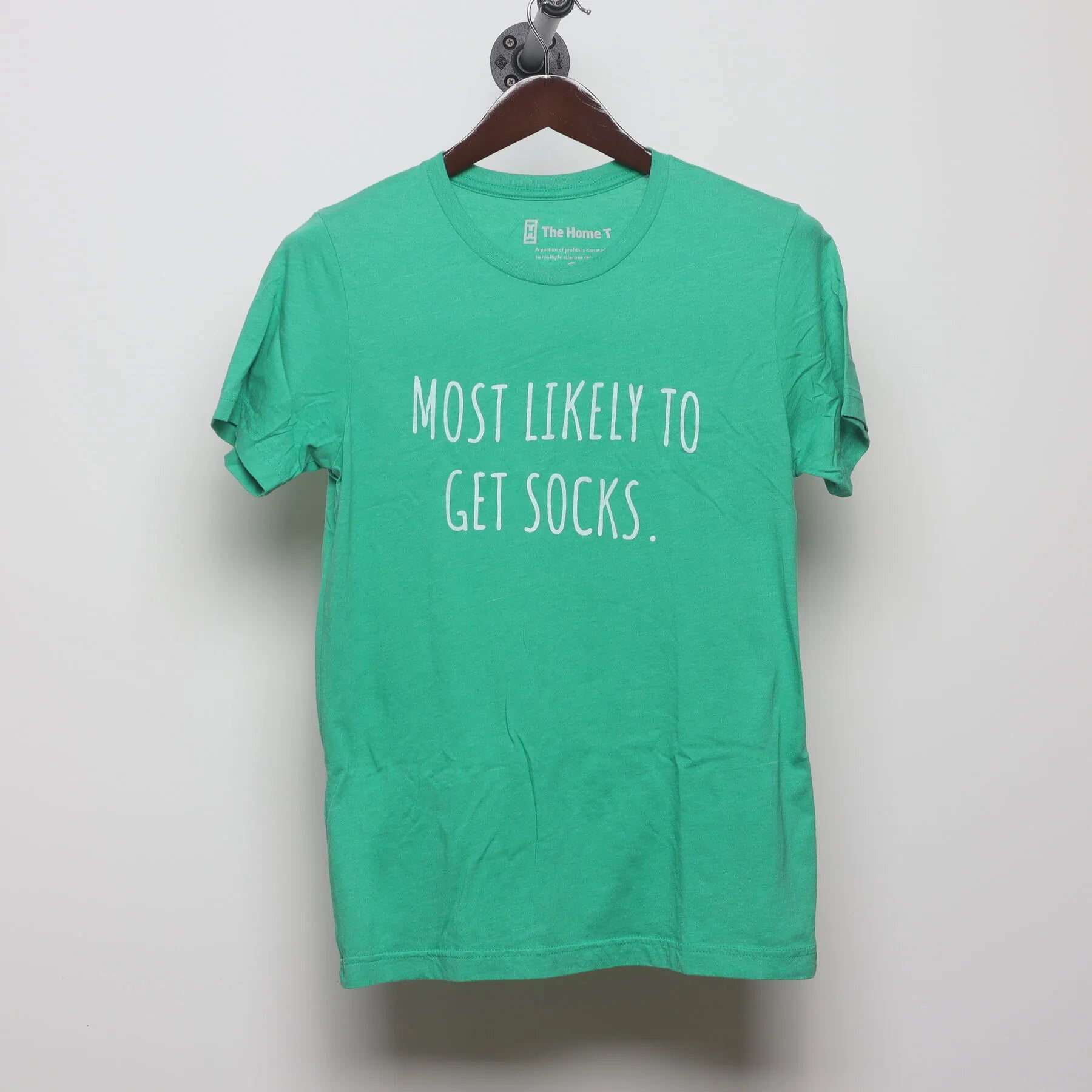 Front view of Modern The Home T "Most Likely To Get Socks" T-Shirt - S