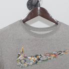 Close-up of the collar and tag on the Vintage Y2K Nike "Photo Collage Swoosh" T-Shirt - M