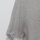 Close-up of the Left sleeve on the Vintage Y2K Nike "Photo Collage Swoosh" T-Shirt - M