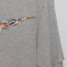 Close-up of the Right sleeve on the Vintage Y2K Nike "Photo Collage Swoosh" T-Shirt - M