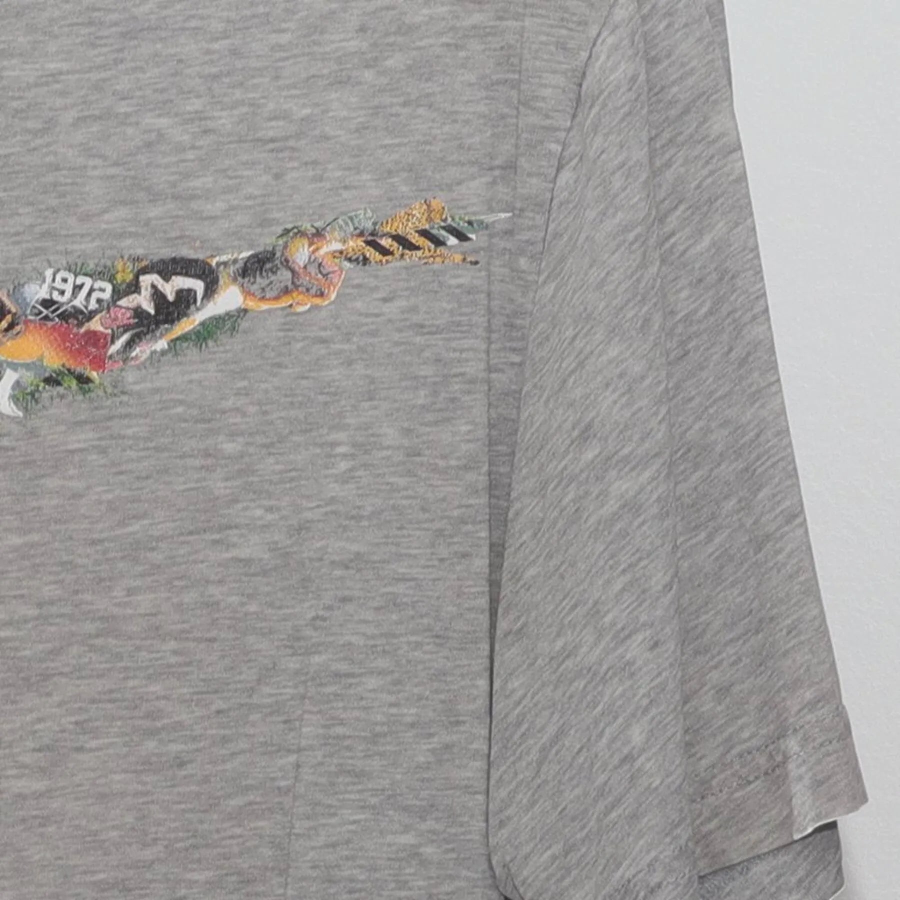 Close-up of the Right sleeve on the Vintage Y2K Nike "Photo Collage Swoosh" T-Shirt - M