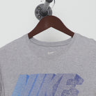 Close-up of the collar and tag on the Vintage Y2K Nike "Gradient Block Logo" T-Shirt - S