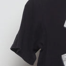 Close-up of the Left sleeve on the Vintage Y2K Nike "Just Do It" T-Shirt - S